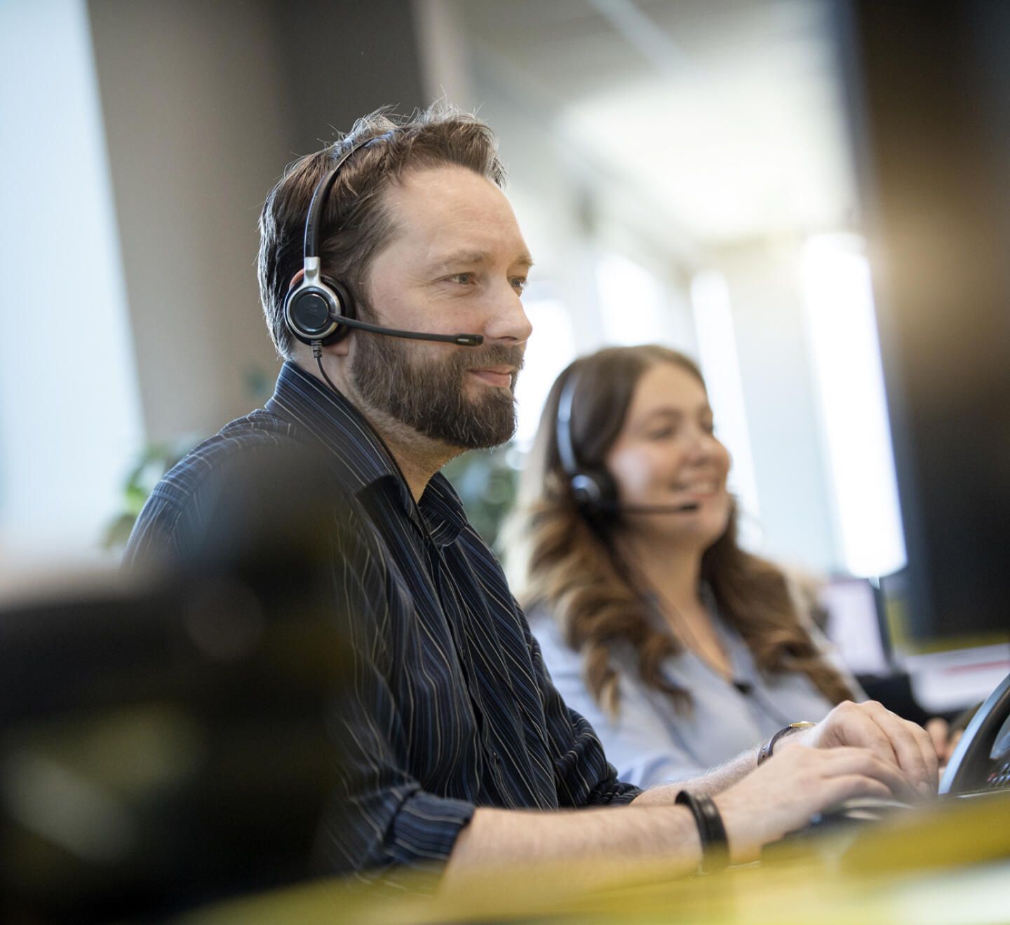 alt="Lemon Contact Centre operators wearing headsets speaking to clients"