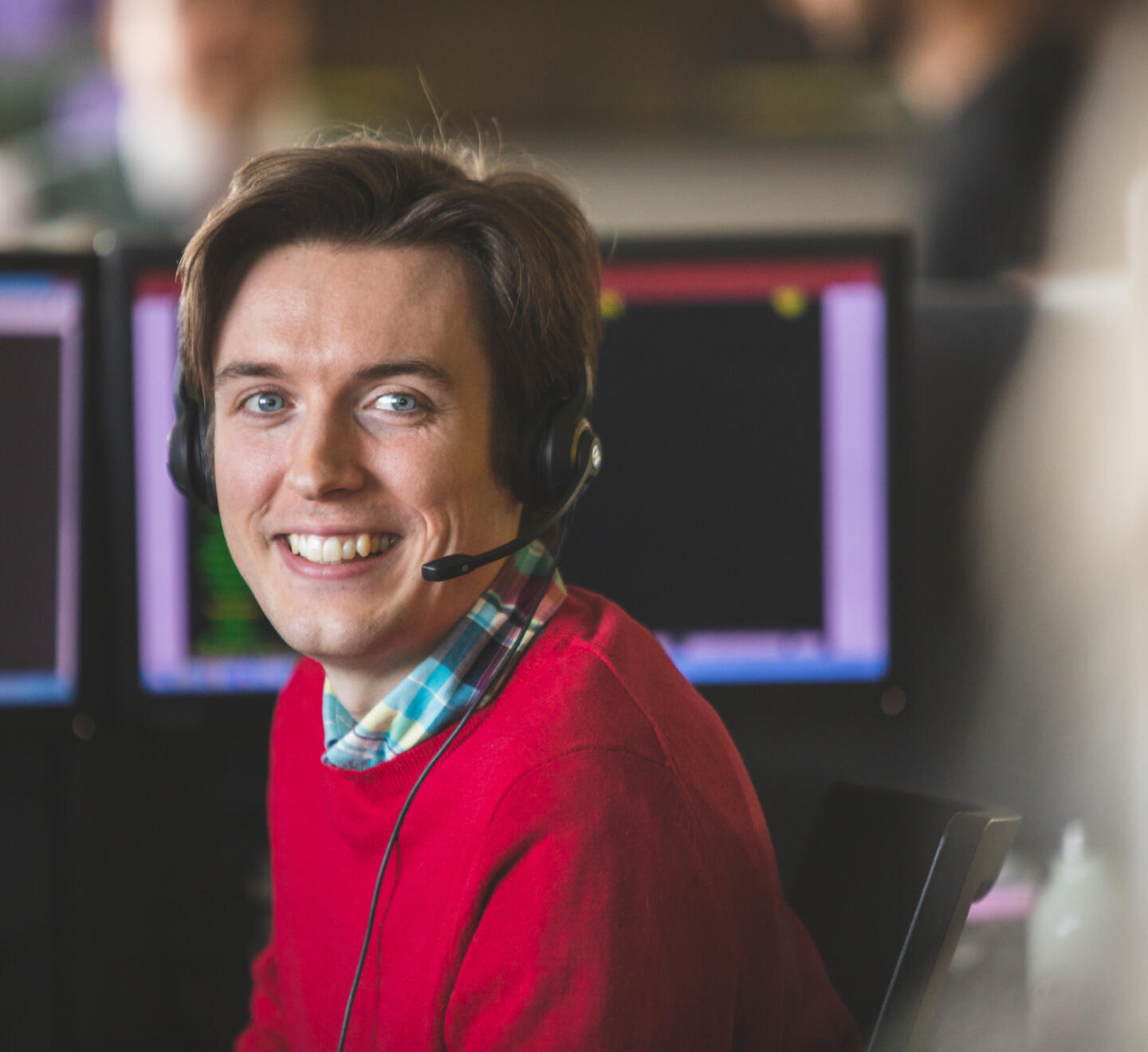 alt="Lemon Contact Centre call centre operator smiling at camera"