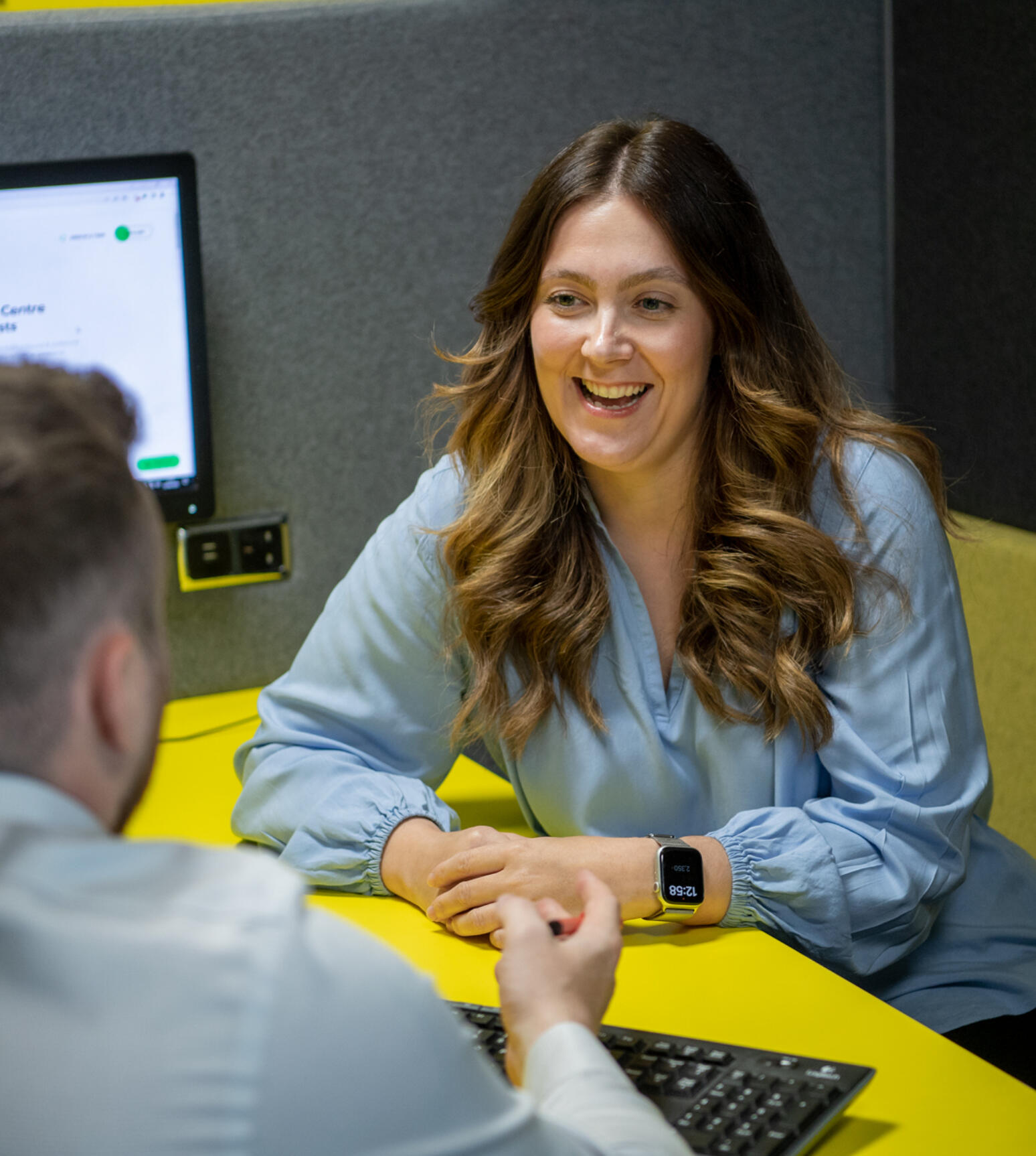 alt="woman smiling during meeting at Lemon Contact Centre"