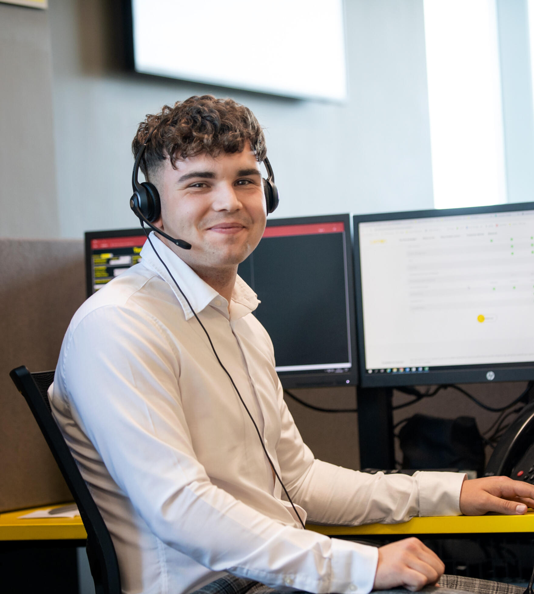 alt="Lemon Contact Centre male operator wearing headset"