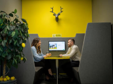 alt="male and female having a meeting at Lemon Contact Centre"