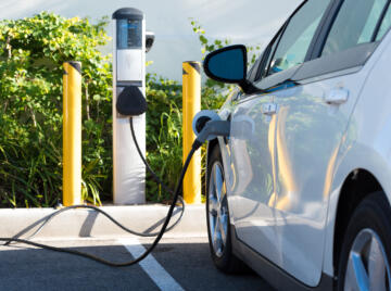 alt="electric vehicle charging at EV charge point"