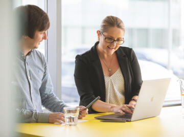 alt="Lemon Contact Centre man and woman having a meeting"