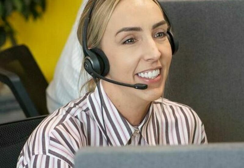 alt="Lemon Contact Centre operator wearing headset"