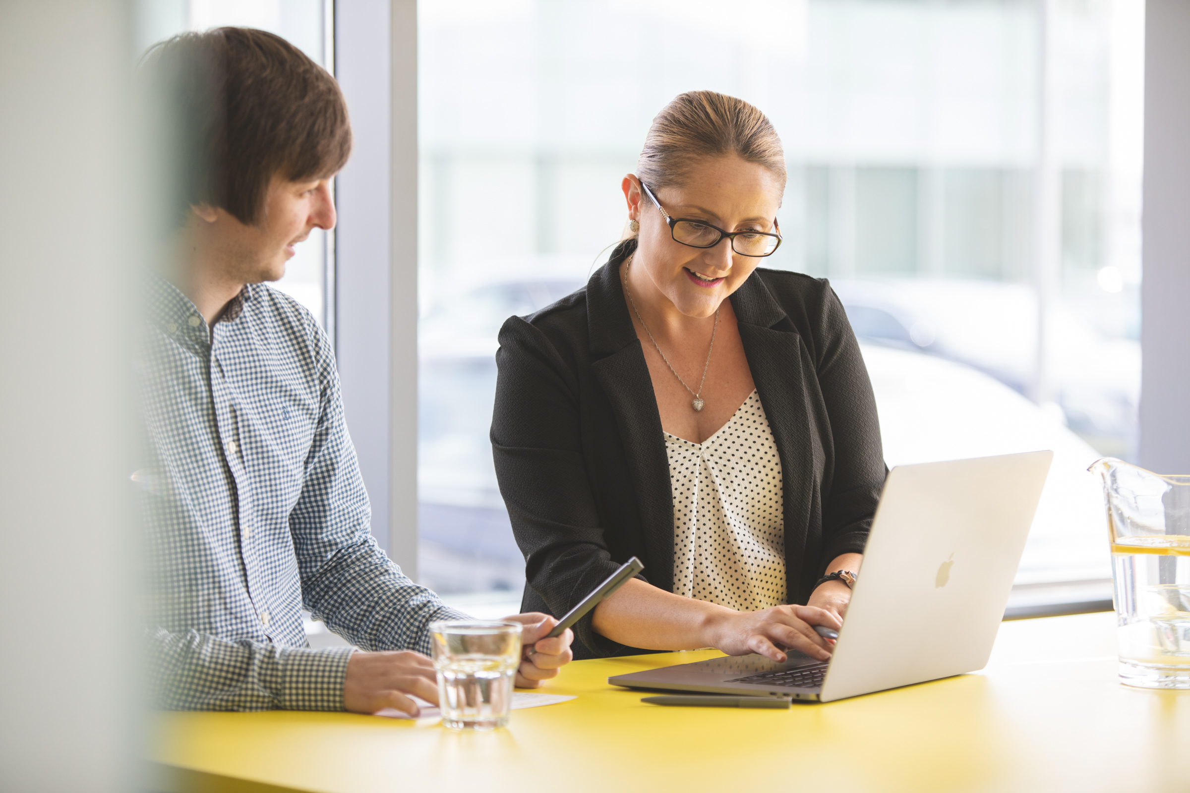 alt="Lemon Contact Centre man and woman having a meeting"